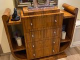 a wooden table with a mirror and a clock on top of it