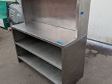 an image of a stainless steel shelf with shelves on it