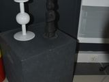 a small table with a lamp on it next to a radiator