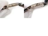 a pair of gloves that are holding a pair of scissors