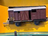 a toy train car that is on display in a box