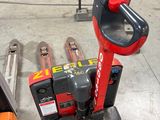 an image of a forklift in a warehouse with other tools