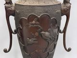 a large vase that is sitting on a stand