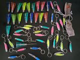 a lot of different types of fishing lures on the table