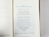 someone is holding a book open to a page with a list of things on it