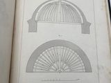 an open book with a drawing of a dome on top of it
