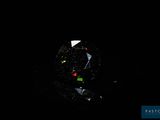 an image of a close up of a glass ball in the dark
