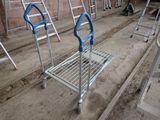 many ladders that are lined up in a room