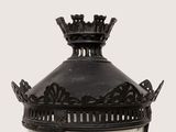 a black lamp post with a crown on top of it