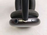 a close up of a pair of headphones on top of a cell phone