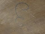 a close up of a metal bowl with a number 3 on it