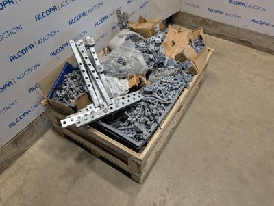 a box of screws and bolts on the floor