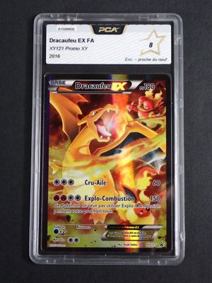 a close up of a pokemon card in a plastic case