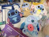 many stuffed animals on a table in a store