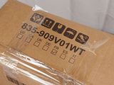 a brown box with a black sticker on it sitting on a white surface