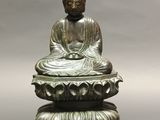 an image of a statue of buddha sitting on top of a lotus