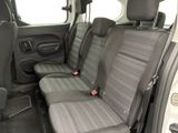 the interior of a van with two seats and a seat belt