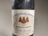 a bottle of wine that is sitting on a table