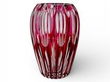 a red vase that is sitting on a white surface
