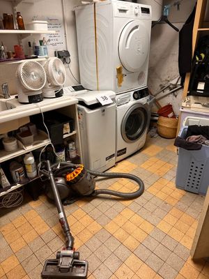 an image of a room with a washer and dryer in it