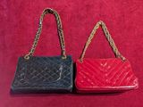 pair of red and black purses on a red background