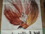 french movie poster of a woman with a feather on her head
