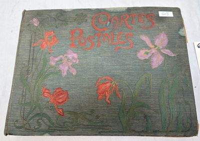 an old book with a picture of flowers on it