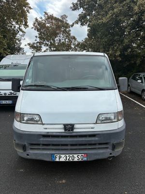 a white van that is parked in a parking lot