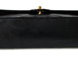 black leather purse on white background with clipping for text