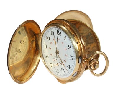 a gold pocket watch that is open on a white background