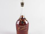 a close up of a bottle of brandy on a white background