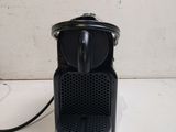 a black coffee maker sitting on a counter top