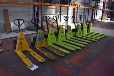 a lot of pallets that are lined up in a warehouse