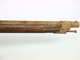 an old gun with a wooden barrel on a white background