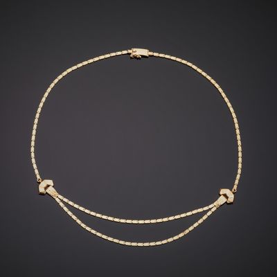 a gold and diamond necklace, by business