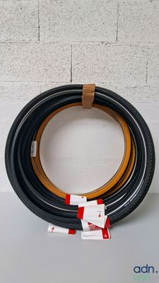 a black and brown tire with a red stripe on it