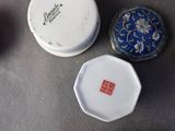 three small boxes that are sitting on a table