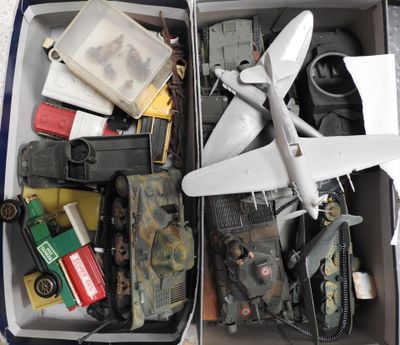 a suitcase full of assorted toys and military items