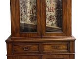 an image of a wooden china cabinet with glass doors and drawers