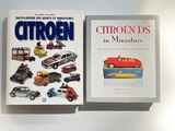 deux livres posés sur une table blanche, avec l'image d'une voiture et d'un camion