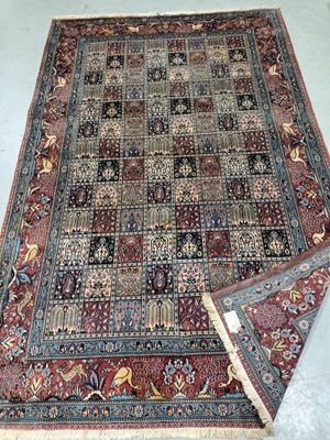 a close up of a rug on a floor with a white background