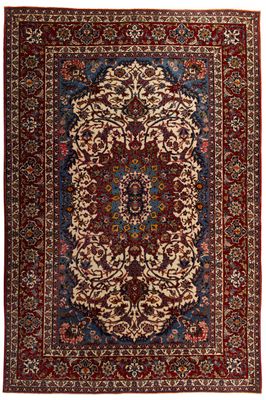 un tapis rouge et bleu à motifs de médaillons