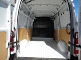 a white van that is parked in a parking lot