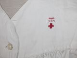 an image of a white shirt with a red cross on it
