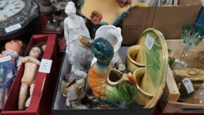 many different items in a box on the table