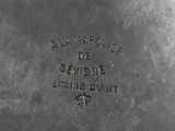 a close up of a metal object with writing on it