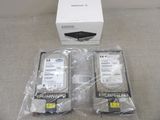 two hard drives in the package on the table