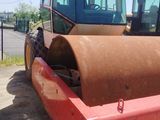 a picture of a construction vehicle that is parked in a lot