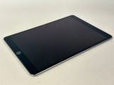 a close up of a tablet computer sitting on top of a table