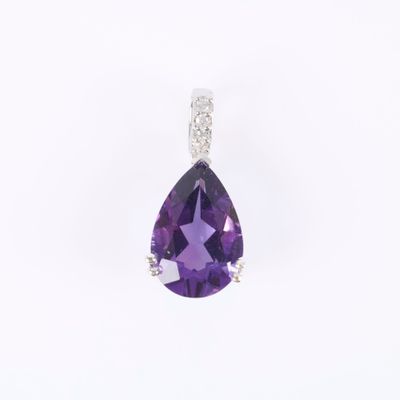 an amethorate and diamond pendant in white gold